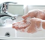 Washing of hands with soap under running water