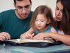 Young family studying the Word of God